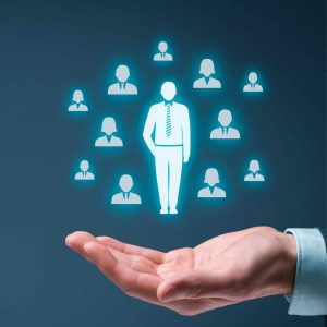 man holding hand up with picture of business people high performance leaders